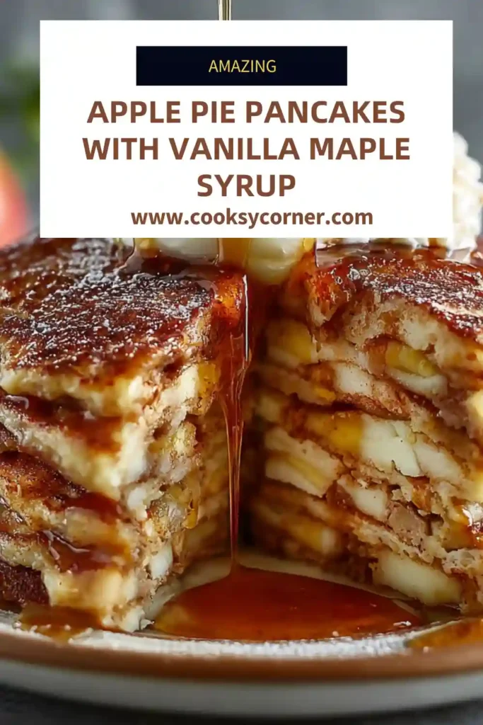 Apple pie pancakes stacked high and topped with vanilla maple syrup and diced apples. The pancakes are fluffy, golden, and full of warm cinnamon flavor.