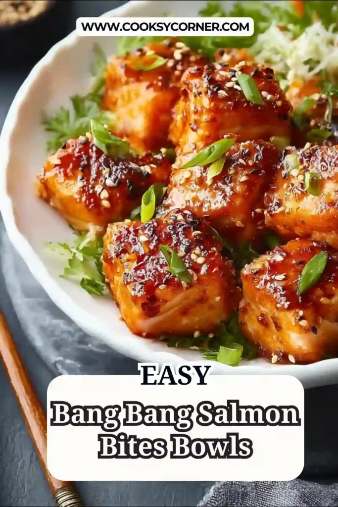 Bang bang salmon bowl topped with fresh vegetables and sesame seeds.