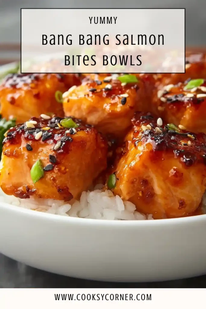 Crispy salmon bites served in a bowl with vegetables and bang bang sauce.
