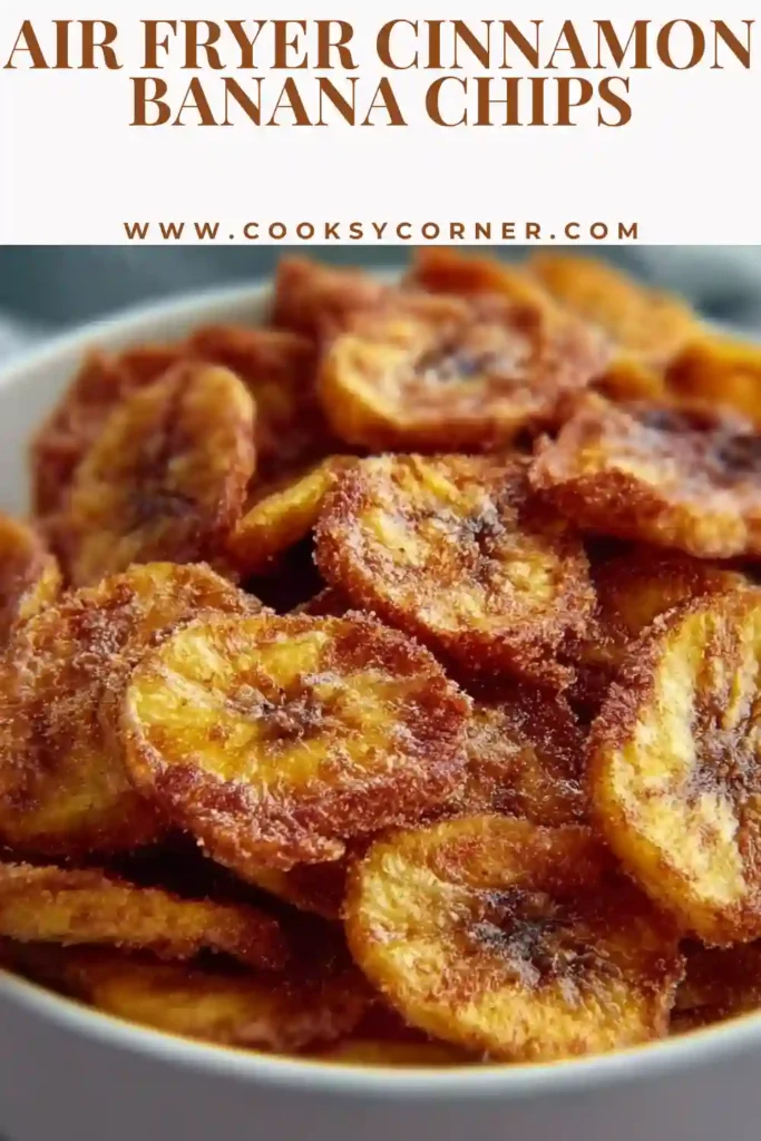 Thin banana slices coated with cinnamon before air frying into crunchy banana chips. A healthy air fryer snack idea.