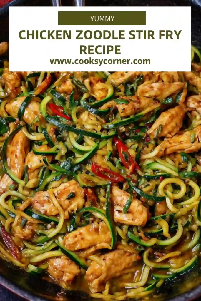 Close-up of chicken zoodles coated in savory stir fry sauce with garlic, ginger, and chili.