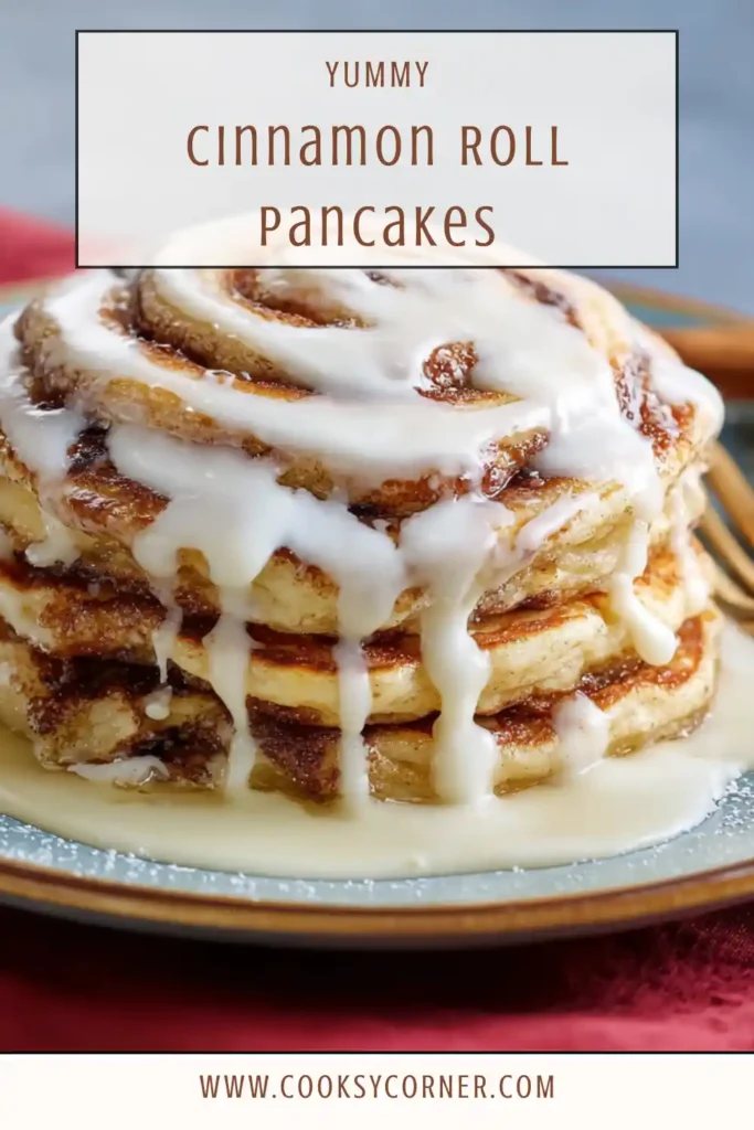 Close-up of homemade Cinnamon Roll Pancakes with golden edges and smooth cream cheese topping.