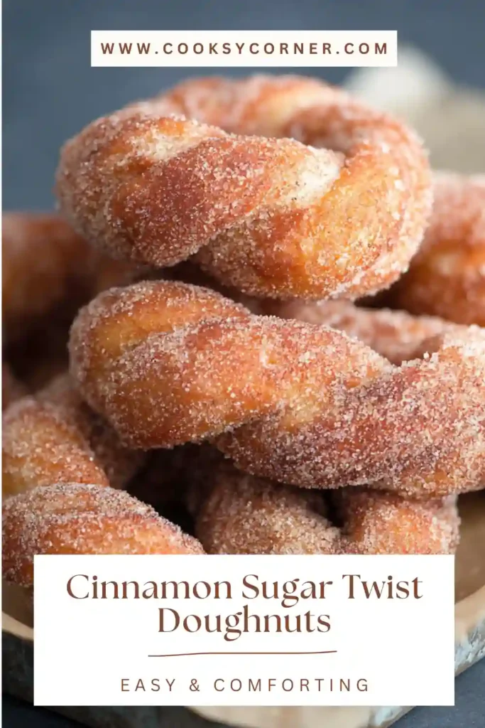 Cinnamon sugar twist doughnuts fried until golden and coated generously in cinnamon sugar. The doughnuts look fluffy and crisp.