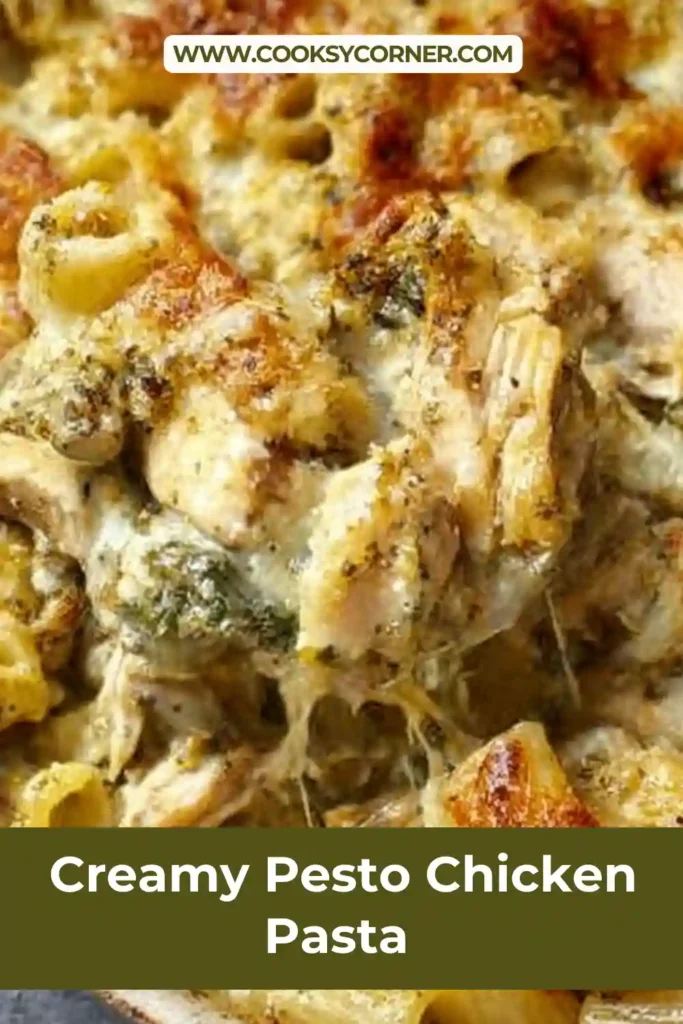 Close-up of creamy pesto chicken pasta bake with golden cheese topping.