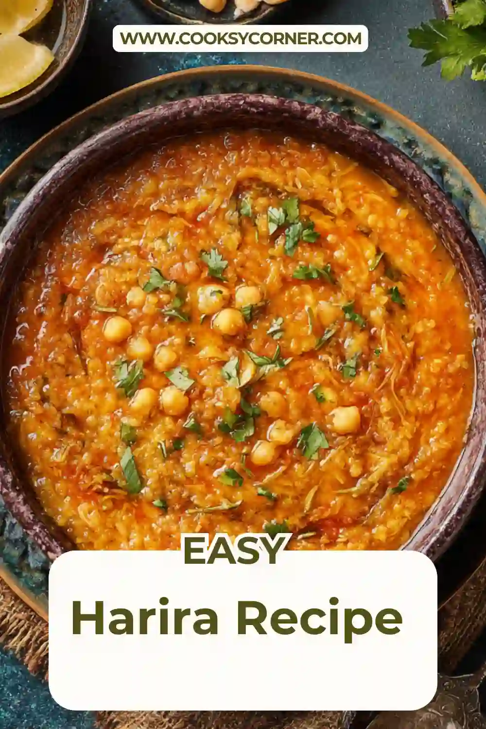 Vegetarian gluten free Harira soup with lentils, chickpeas, and tomatoes served with lemon wedges.