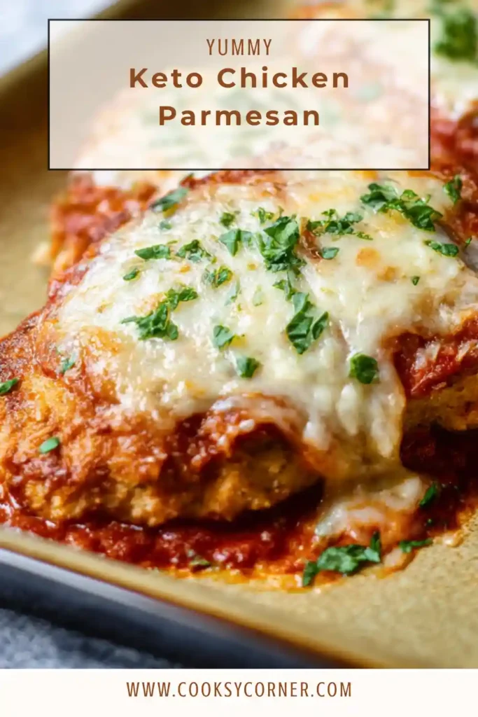 Cheesy keto chicken parmesan on a baking tray.