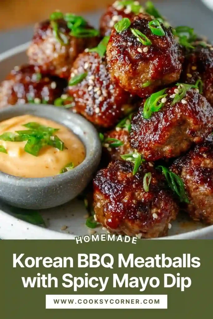 Korean BBQ meatballs served with spicy mayo dip, garnished with sesame seeds and green onions, showing a glossy sweet-spicy glaze.