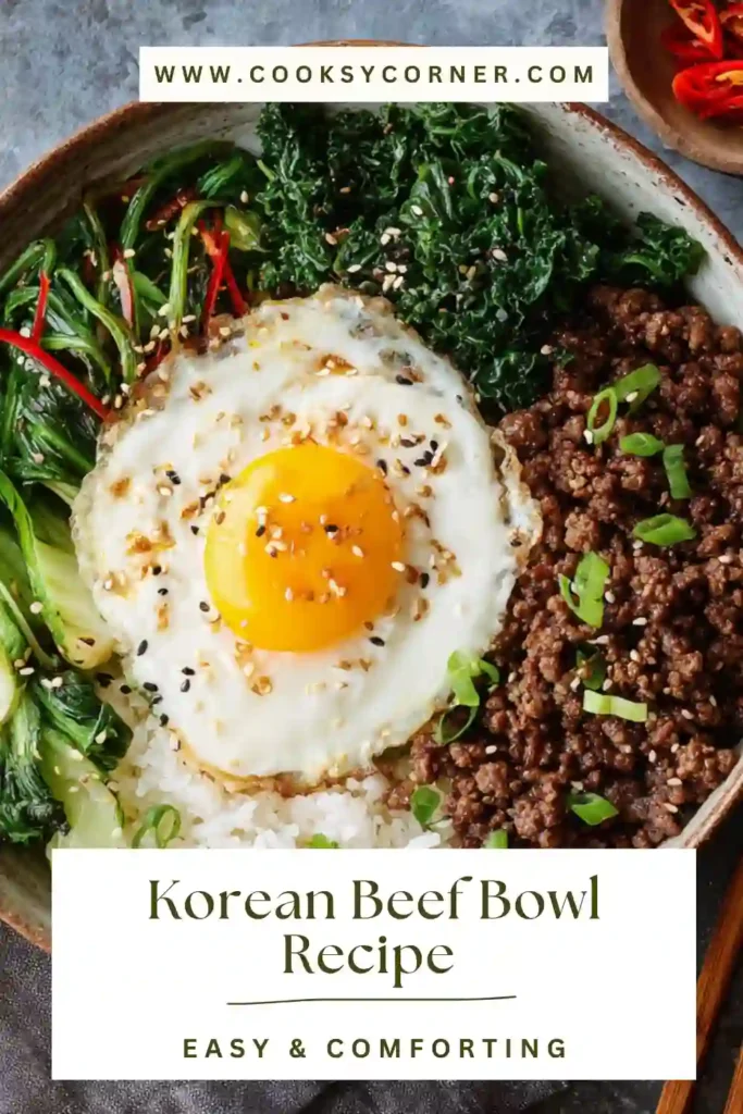 Korean Beef Bowl served over rice with ground beef, cucumbers, carrots, and sesame seeds in a shallow bowl. The dish looks glossy, fresh, and vibrant.