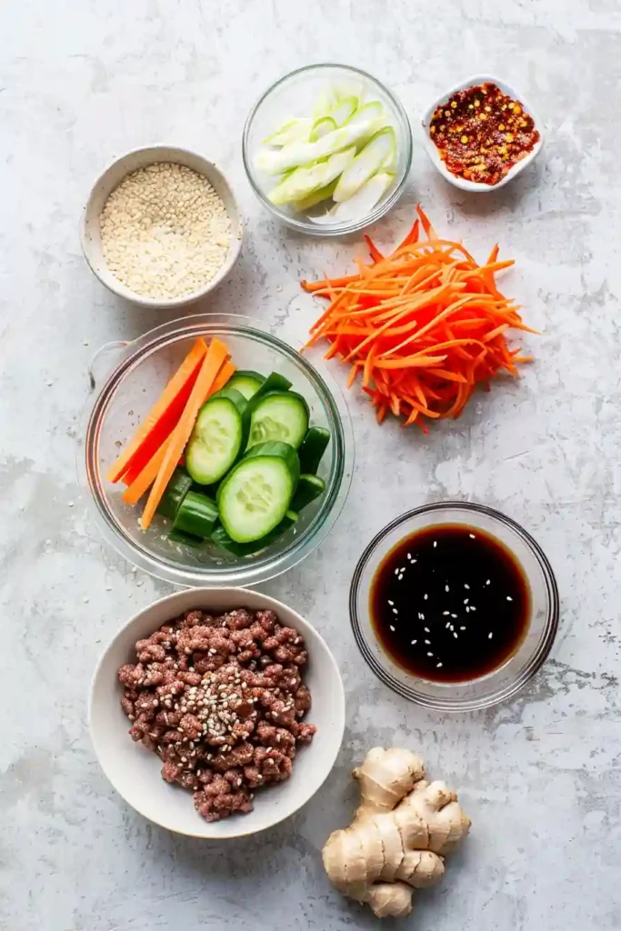 Homemade Korean Beef Bowl with ground beef, rice, and fresh toppings photographed from above.