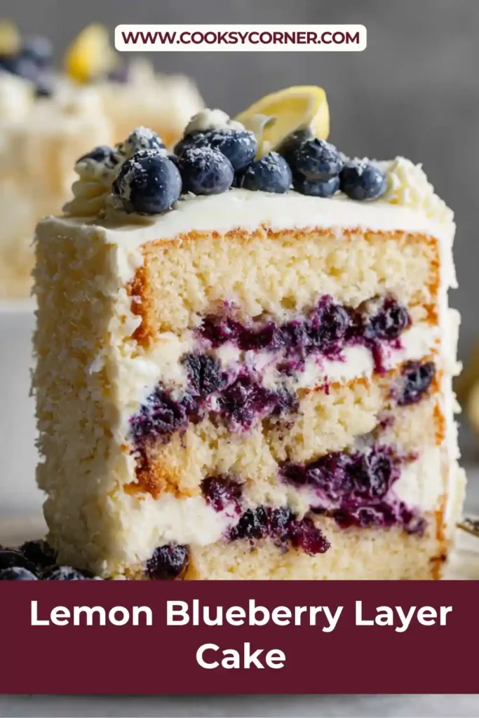 Close-up of lemon blueberry layer cake with moist crumb and blueberry pieces throughout.