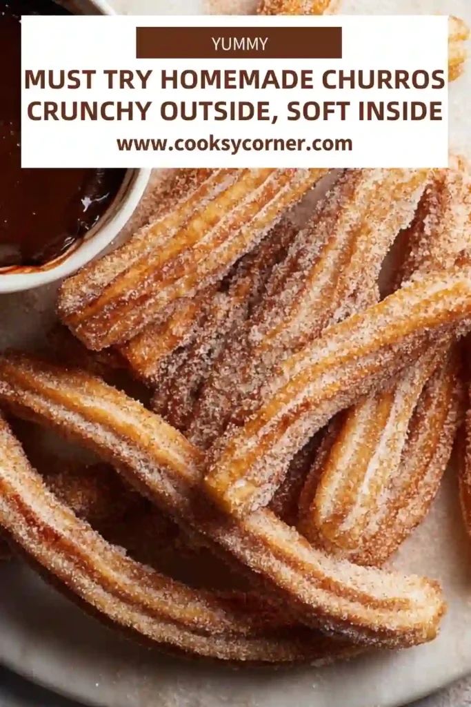 Close-up of crispy homemade churros broken open to reveal soft center with chocolate dip.