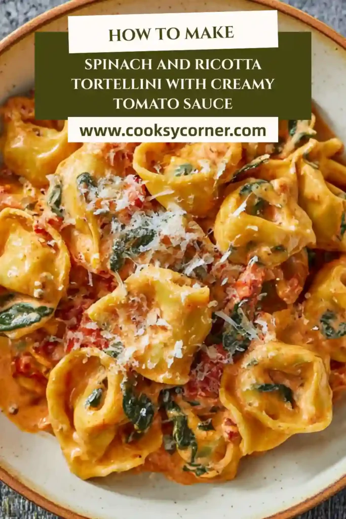Creamy tomato tortellini made with spinach and ricotta pasta, finished with grated parmesan in a skillet.
