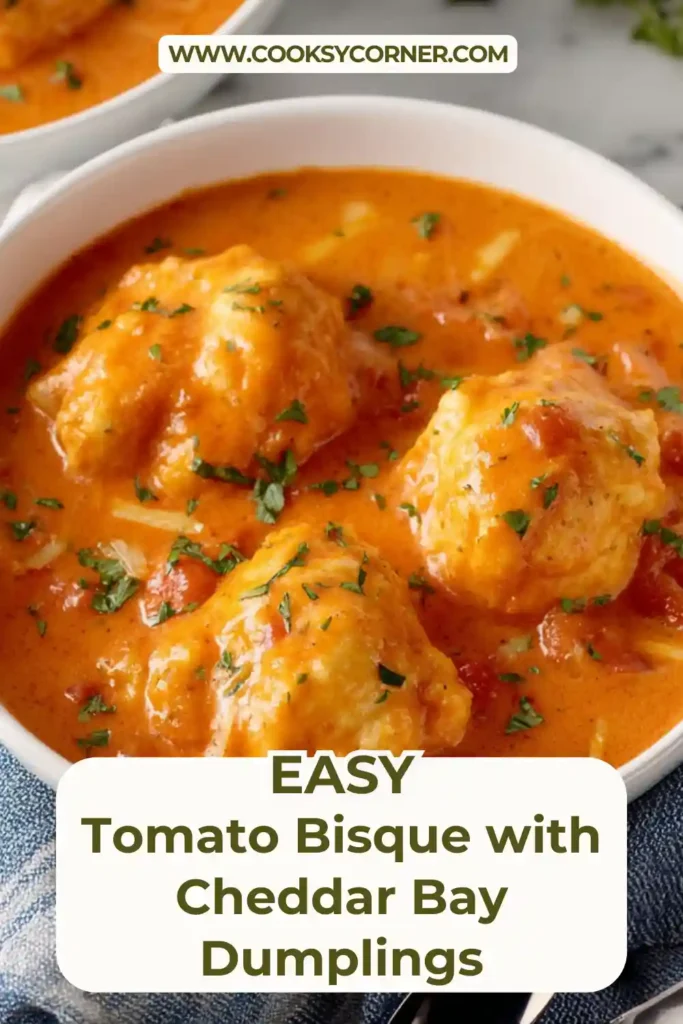 Tomato bisque with garlic cheddar dumplings in a pot.