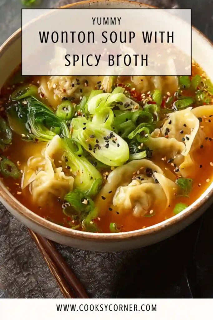 Close-up of spicy wonton soup with dumplings in a flavorful gochujang broth.