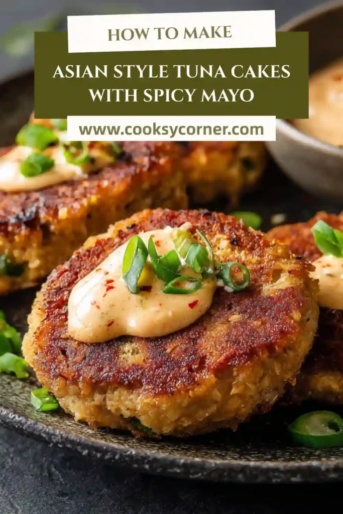 Golden Asian-style tuna cakes topped with spicy mayo on a white plate.
