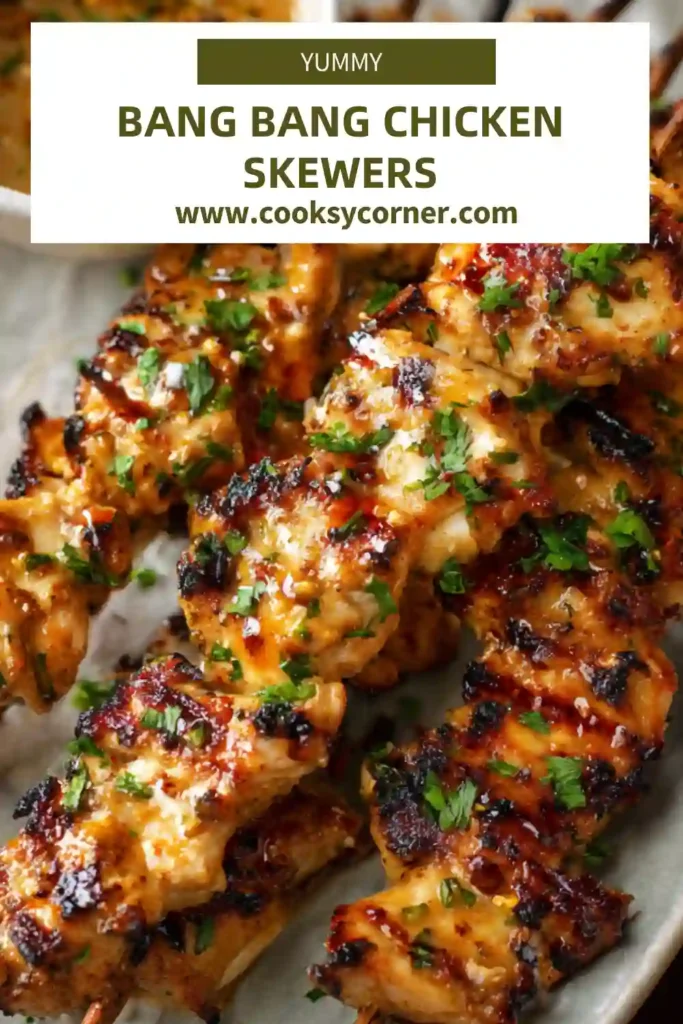 Bang Bang Chicken Skewers coated in creamy sweet chili sauce and air fried until golden brown.