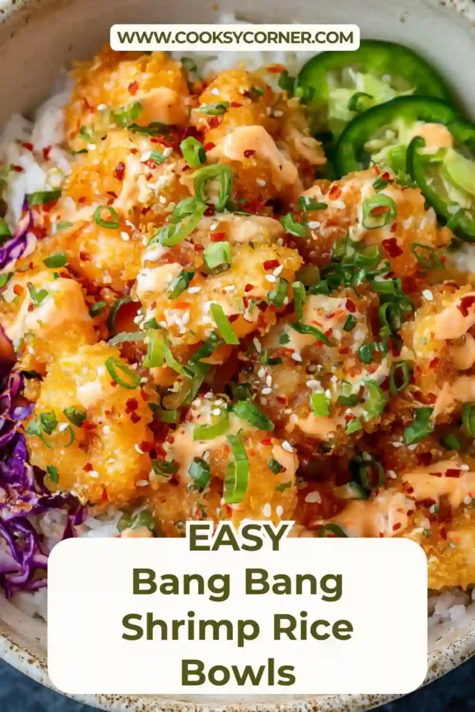 Bang Bang Shrimp Rice Bowls topped with crispy golden shrimp, creamy slaw, avocado slices, and jasmine rice in a white bowl. The shrimp is coated in sweet and spicy bang bang sauce.