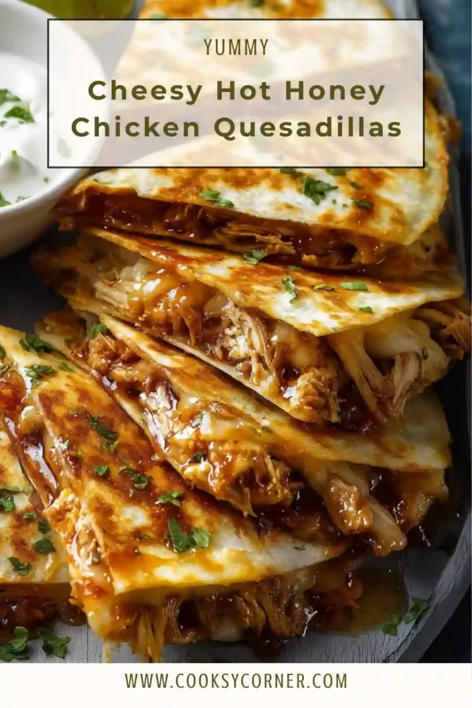 Cheesy Hot Honey Chicken Quesadillas sliced into wedges on a plate with creamy jalapeno sauce. Melted cheese stretches between layers of sweet and spicy chicken filling.