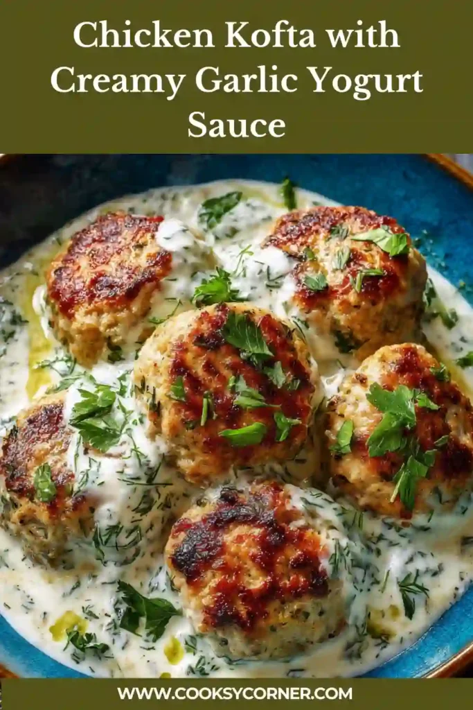 Chicken Kofta with Creamy Garlic Yogurt Sauce served on a platter with fresh parsley and lemon wedges.