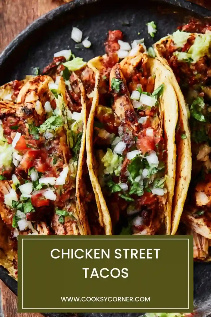 Close-up of Chicken Street Tacos topped with chopped chicken, salsa, and herbs. Street-style Mexican tacos made at home.
