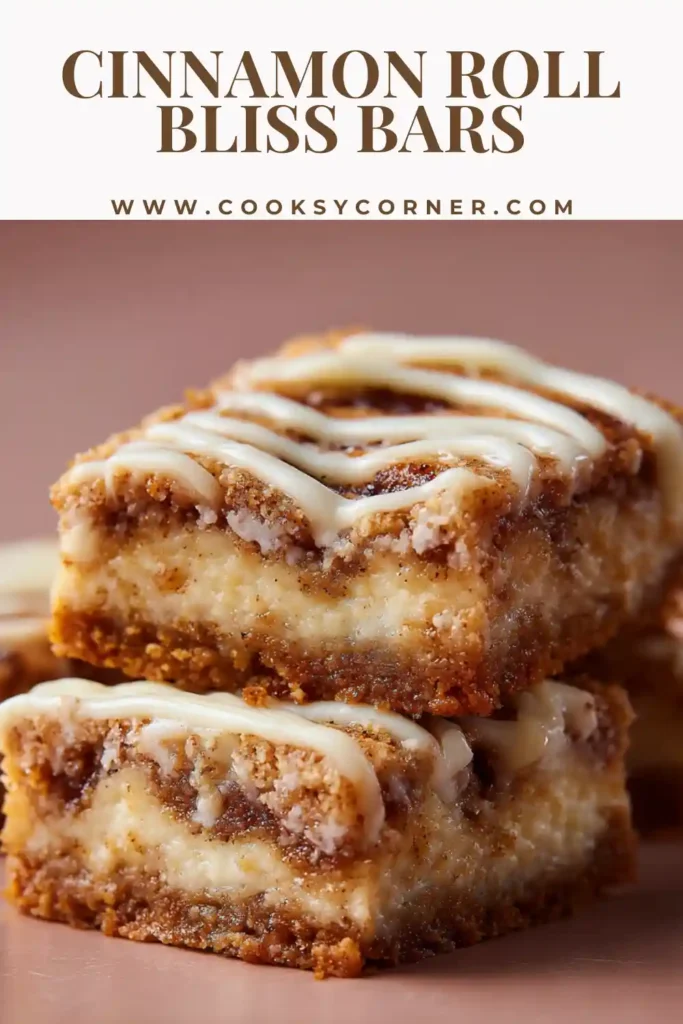 Cinnamon Roll Bliss Bars sliced into squares with creamy cheesecake layers and cinnamon swirl on a graham cracker crust. The bars are drizzled with a smooth vanilla glaze.