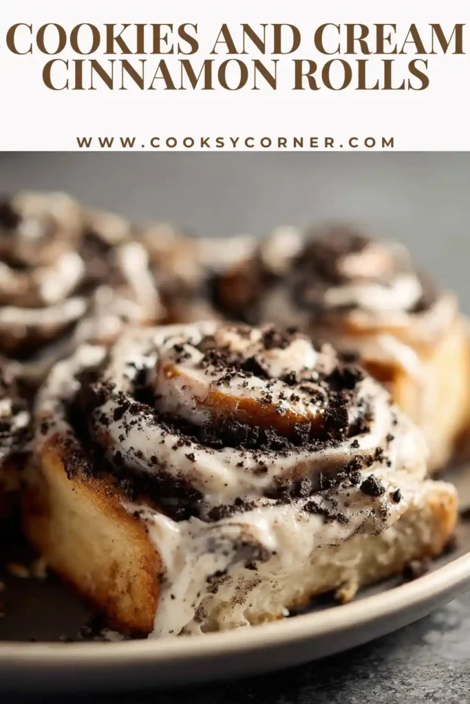Close-up of a soft cookies and cream cinnamon roll with melted cream cheese frosting dripping over cinnamon swirls and cookie crumbs.