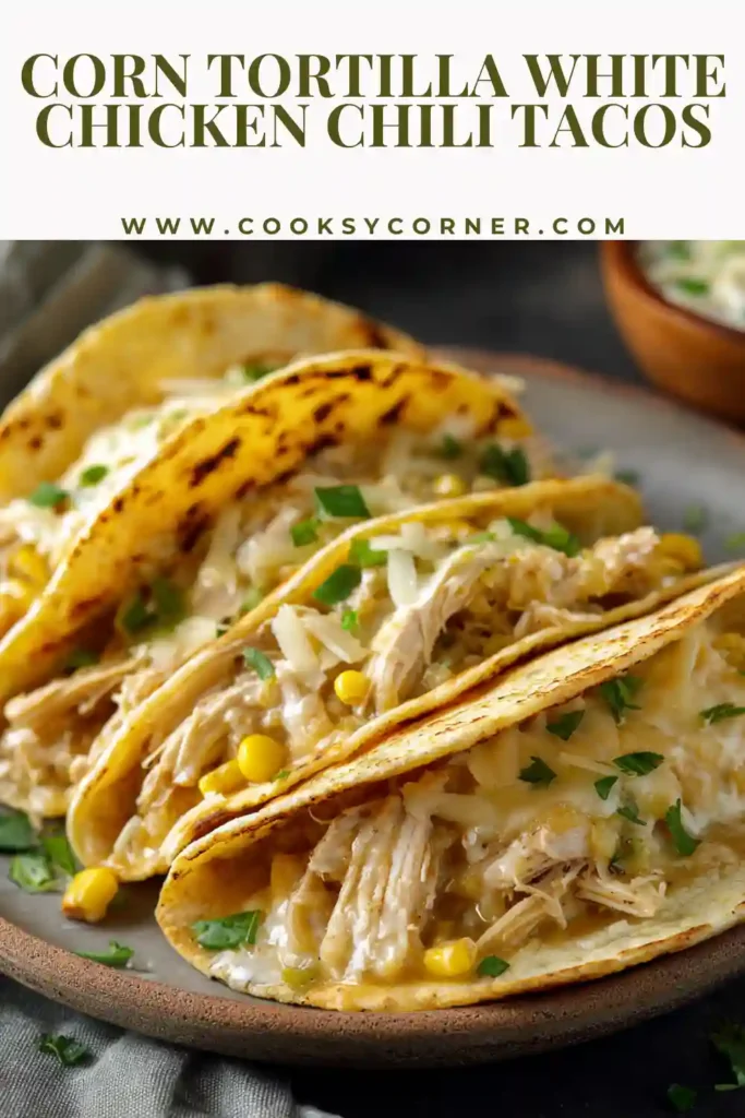 White chicken chili taco filling served in warm corn tortillas with fresh toppings.