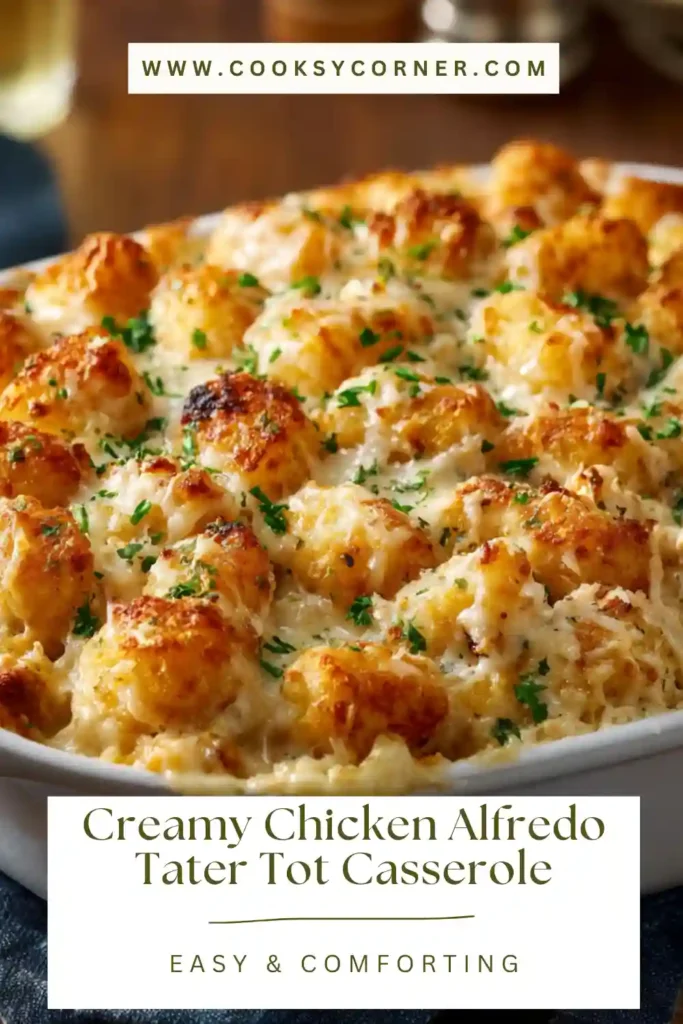 Baked tater tot casserole with shredded chicken and bubbling cheese in a 9x13 baking dish.