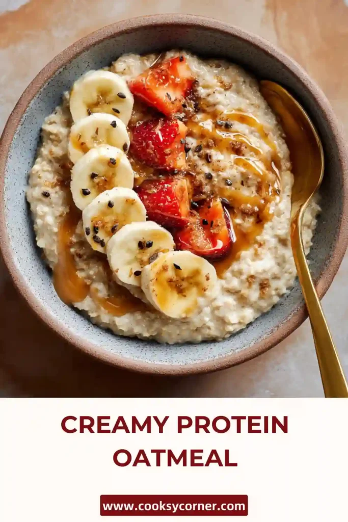High-protein oatmeal topped with fruit and seeds. Creamy Protein Oatmeal ready to serve.
