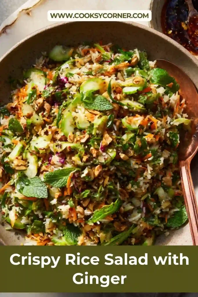 Overhead view of crunchy rice salad topped with scallions, Fresno peppers, and fresh mint leaves.