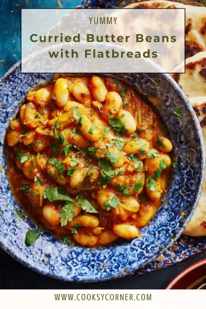 Close-up of creamy butter bean curry topped with chopped coriander and served with flatbread.