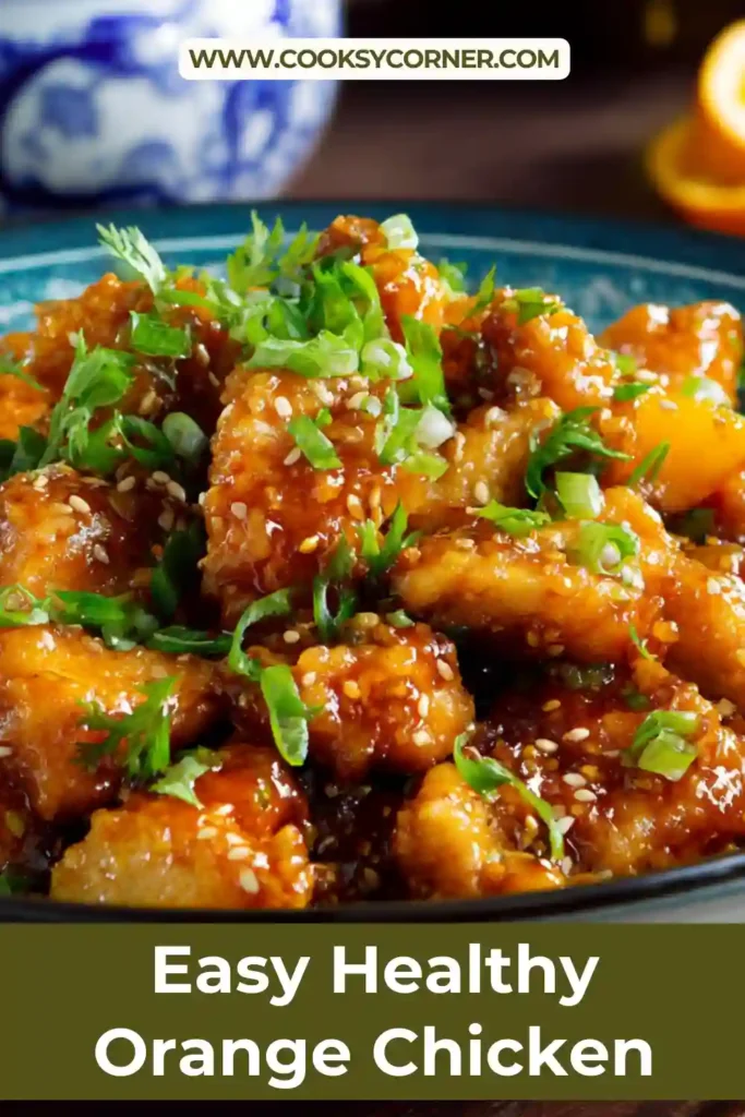 Homemade orange chicken skillet with fresh orange glaze and scallions.