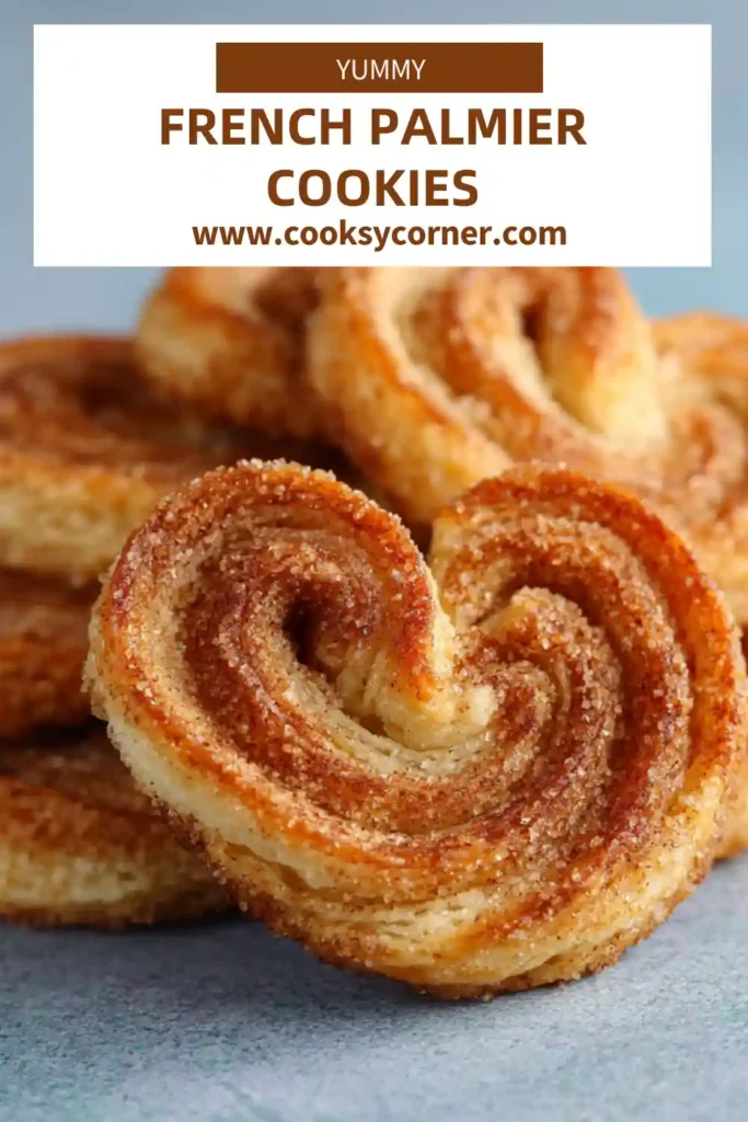 Freshly baked French Palmier Cookies arranged on parchment paper with visible crispy edges and golden finish. Classic French puff pastry dessert.