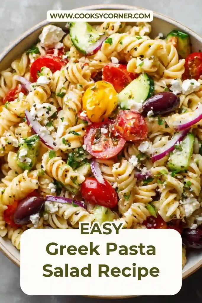 Close-up of Mediterranean pasta salad with feta cheese, fresh parsley, and vibrant vegetables.