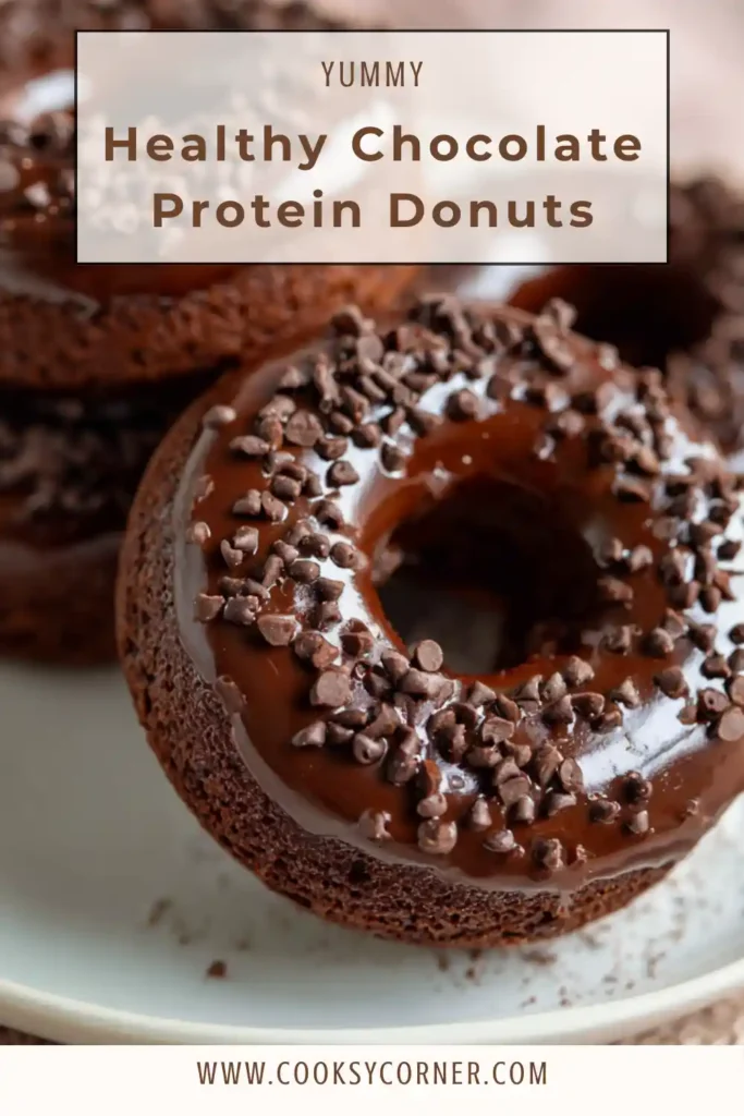 Close-up of a chocolate protein donut dipped in dark chocolate glaze. A healthy baked donut recipe that is gluten free and high in protein.