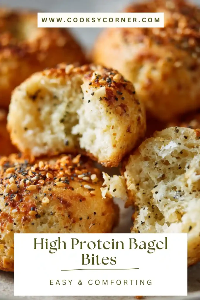 High Protein Bagel Bites baked golden brown and topped with everything bagel seasoning on a parchment-lined baking sheet.