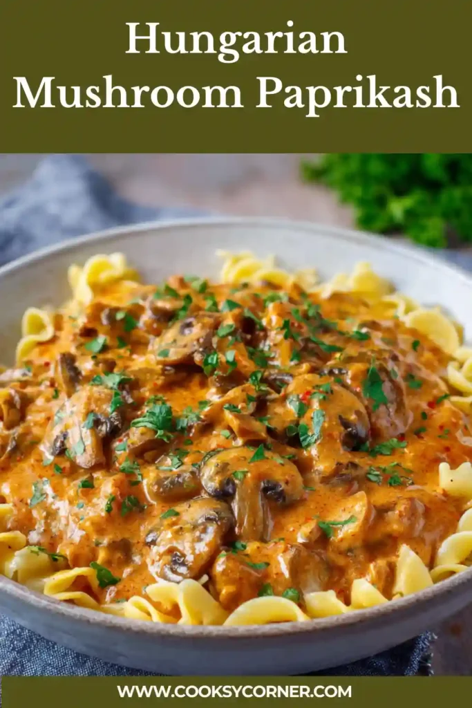 Traditional Hungarian Mushroom Paprikash with rich orange paprika sauce over pasta.