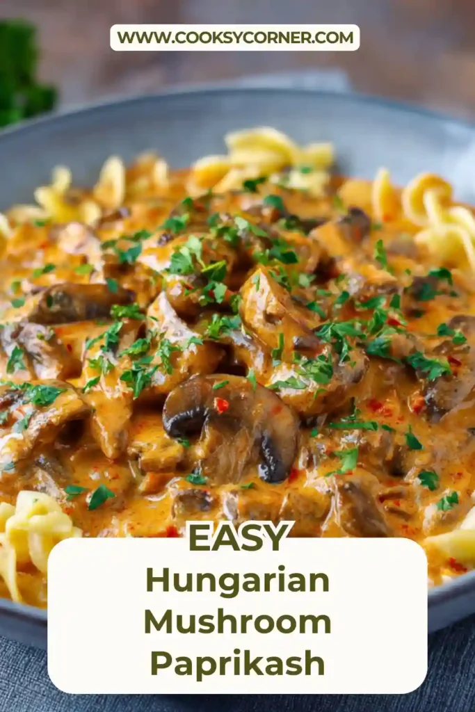 Hungarian Mushroom Paprikash served in a rustic bowl with creamy paprika sauce, beef pieces, and chopped parsley on top.