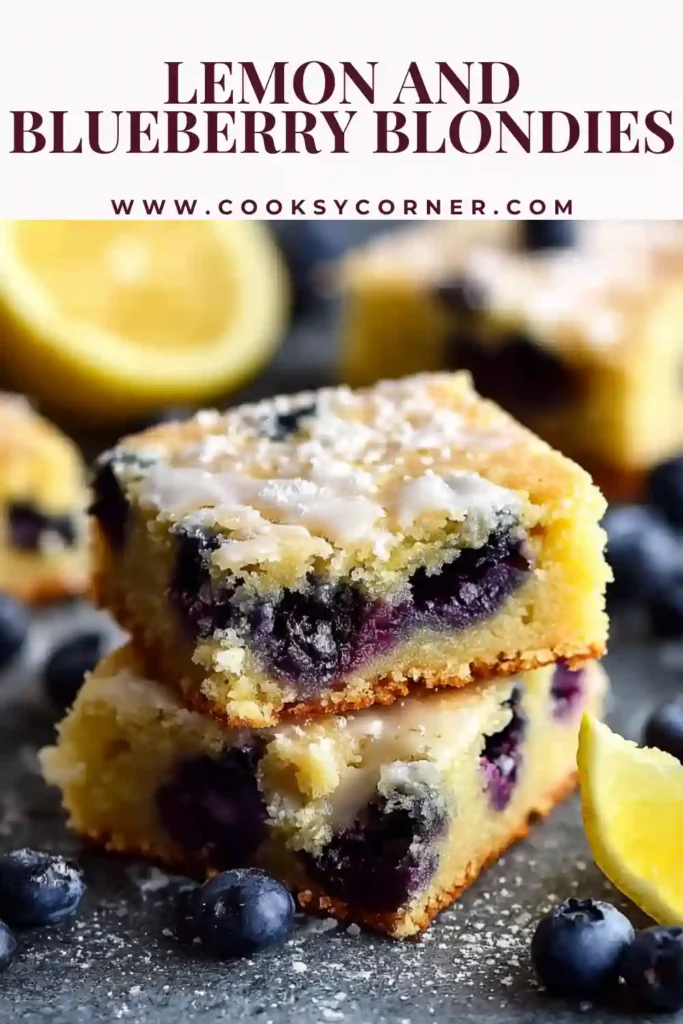 Freshly baked lemon and blueberry blondies in a square pan with golden edges and vibrant blueberry pockets.