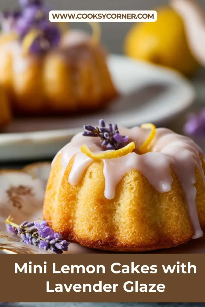 Lemon lavender mini cakes arranged on a serving platter with fresh flowers.