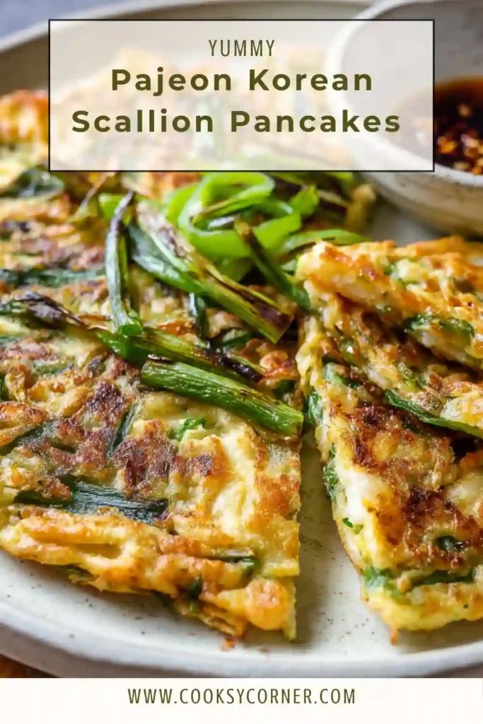 Golden brown Korean scallion pancake with visible fresh scallions and sesame seeds.