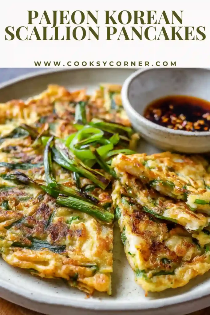 Crispy Pajeon Korean scallion pancakes sliced into wedges and served with soy dipping sauce on the side.
