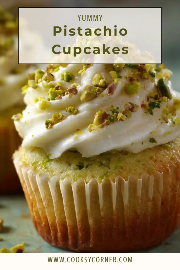 Close-up of soft pistachio cupcake showing light green crumb and fluffy texture.