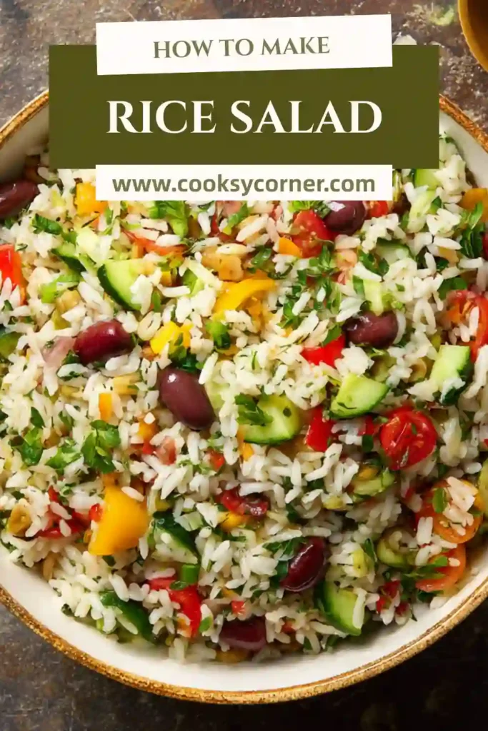 Healthy Rice Salad with chickpeas, bell peppers, olives, and feta sprinkled on top.