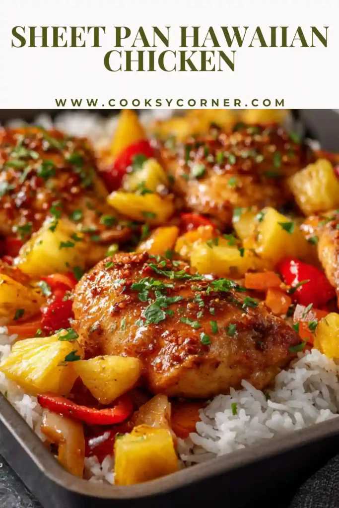 Overhead view of pineapple chicken sheet pan dinner with red and yellow peppers, red onion, and caramelized edges. A vibrant and healthy chicken dinner option.