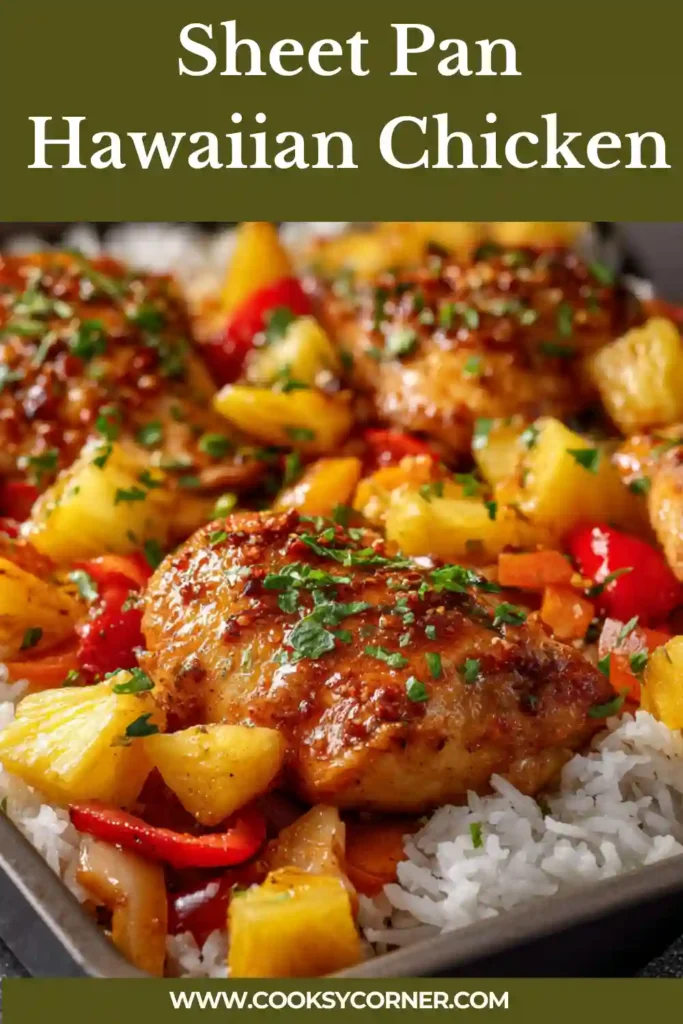 Close-up of Sheet Pan Hawaiian Chicken served over white rice with extra pineapple and glossy sauce spooned on top. The baked chicken looks tender and flavorful.