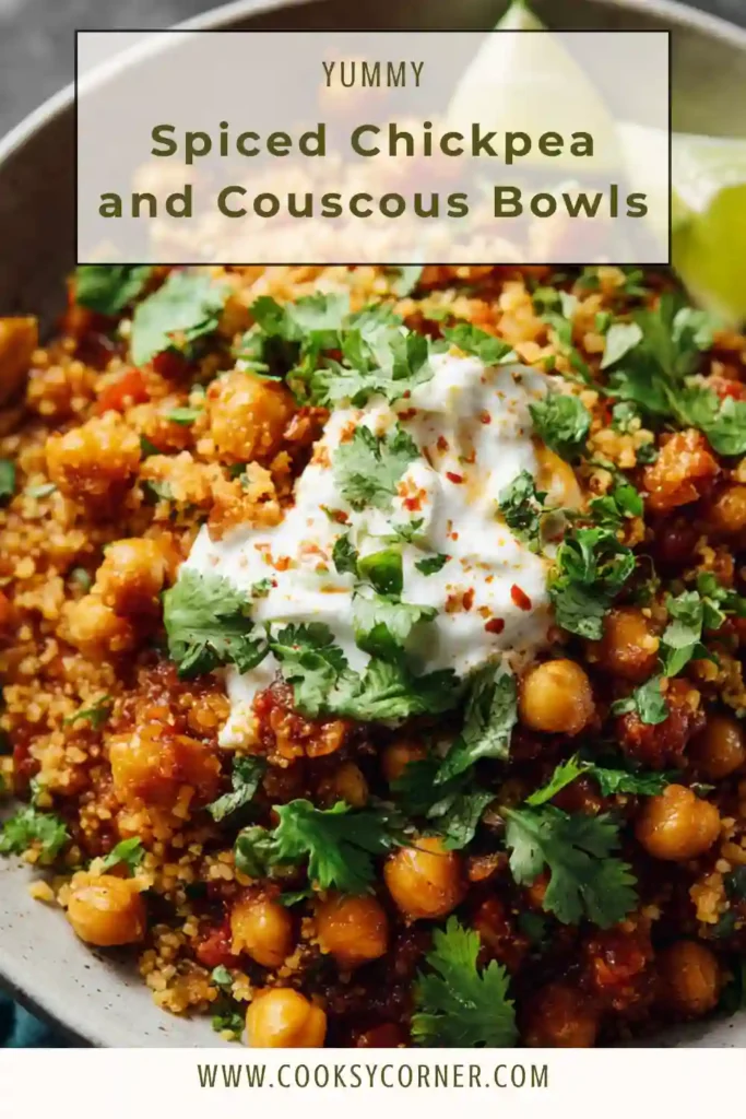 Close-up of chickpea couscous bowl with tomatoes and mint garnish.
