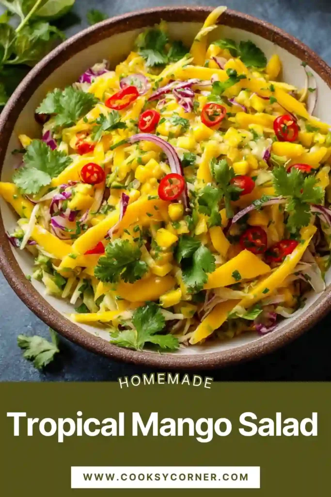 Close-up of mango avocado salad with lime dressing and sliced red onion. The salad looks fresh and vibrant.