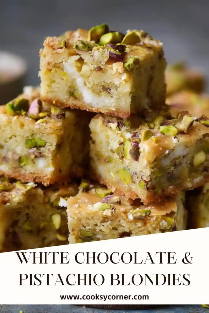 Homemade white chocolate pistachio blondies with glossy drizzle.