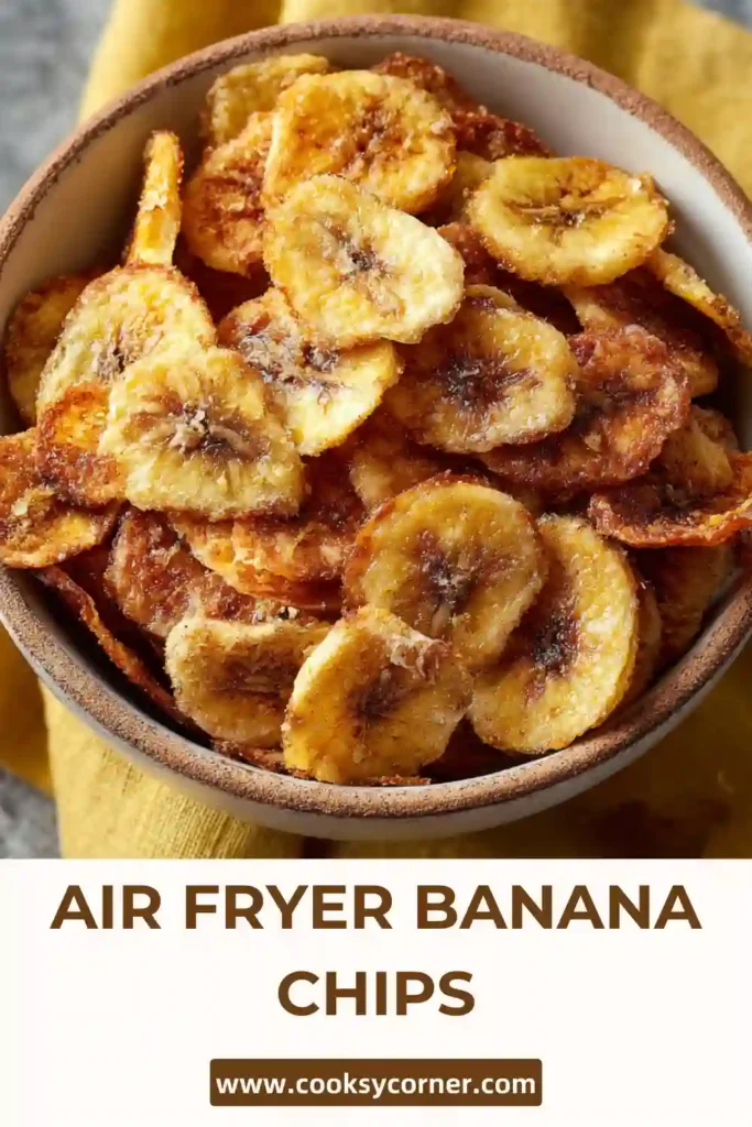 Golden brown banana chips cooked in an air fryer and cooled on a rack.